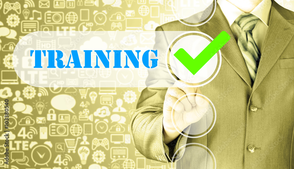 Businessman pressing touch screen interface training checkbox Businessman pressing touch screen interface training checkbox