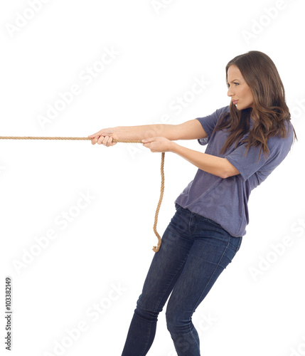 Teenager pulling a rope