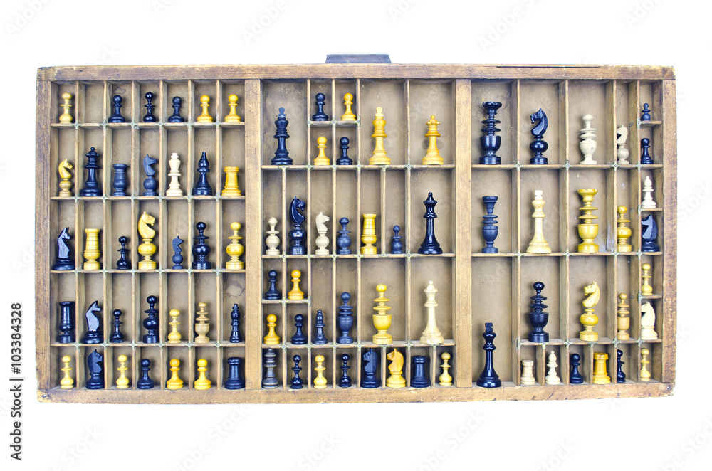 Wooden vintage partitioned drawer shelf with chess figures