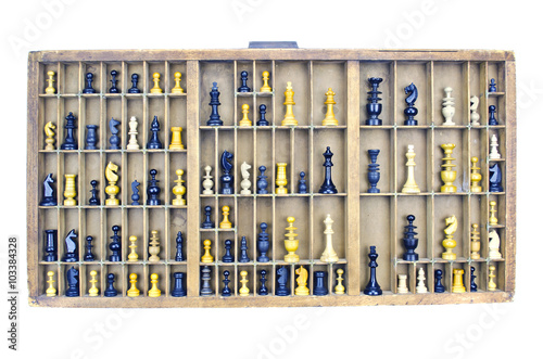 Wooden vintage partitioned drawer shelf with chess figures photo