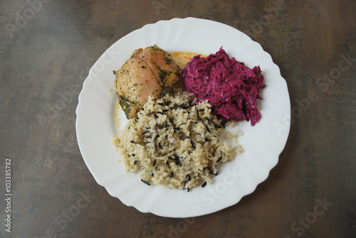 Chicken with wild and white rice and beetroot salad. The finished dish.