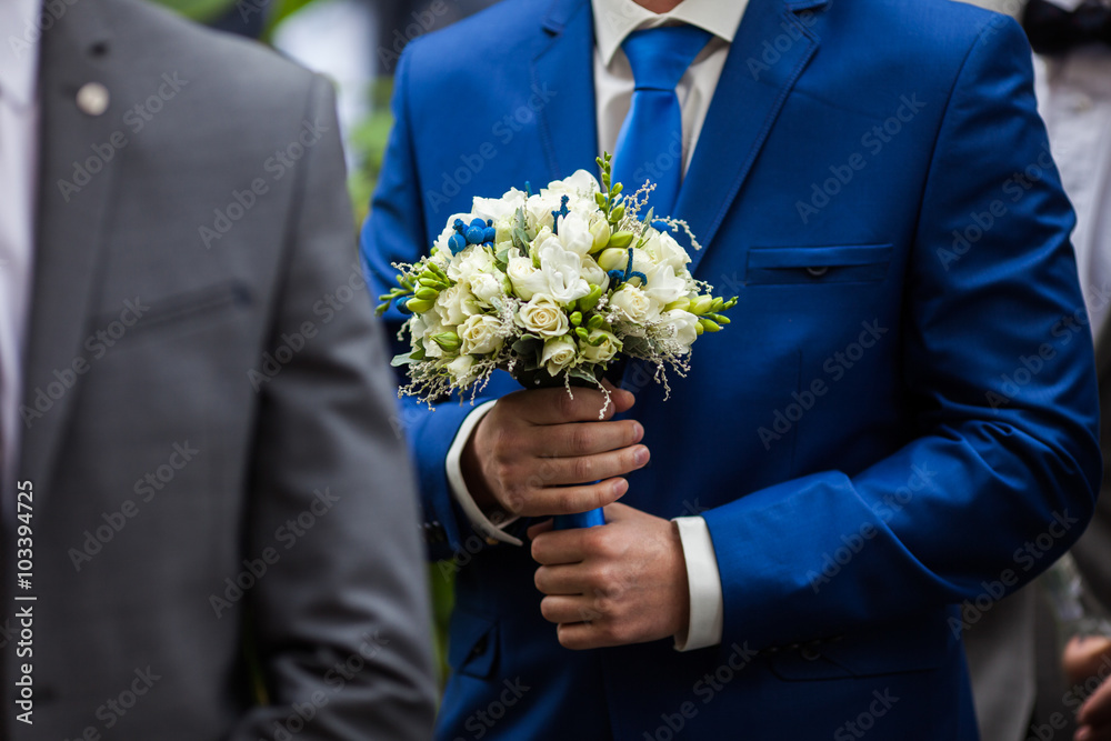 gorgeous elegant groom in blue suit holding stunning stylish bou gorgeous elegant groom in blue suit holding stunning stylish bou
