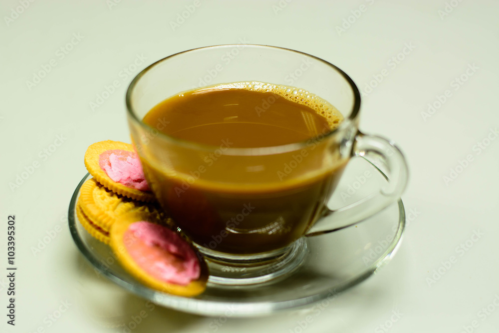 Coffee and Pink Cookie Cream Filling on glass table Coffee and Pink Cookie Cream Filling on glass table