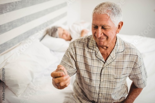 Wallpaper Mural Happy senior man sitting at table and having coffee Torontodigital.ca