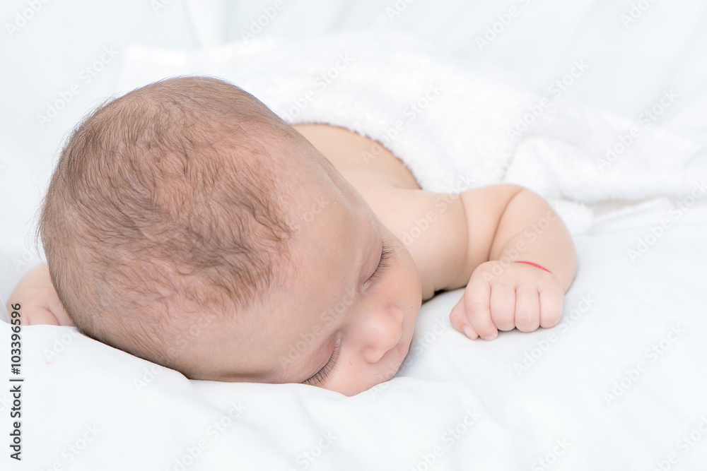 picture of a newborn baby curled up sleeping on a blanket picture of a newborn baby curled up sleeping on a blanket