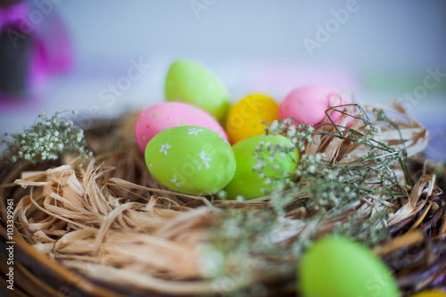 Nesting box with Easter coloder eggs photo