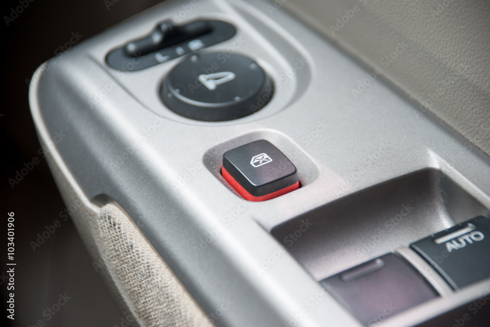 Detail on buttons controlling the door locking in a car Detail on buttons controlling the door locking in a car