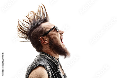 Angry young punk rocker screaming photo