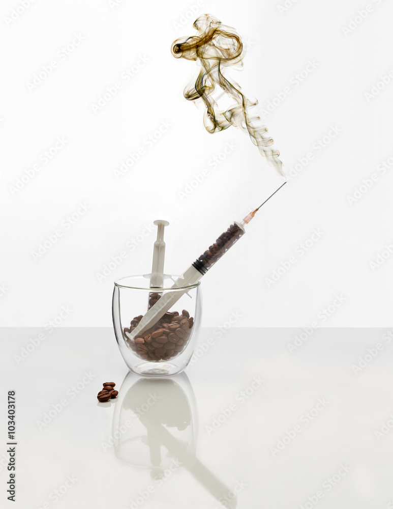 Coffee intravenous drug. Coffee Beans in plastic syringe.