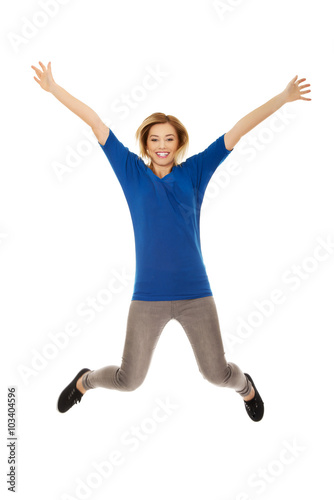 Young happy woman jumping in the air