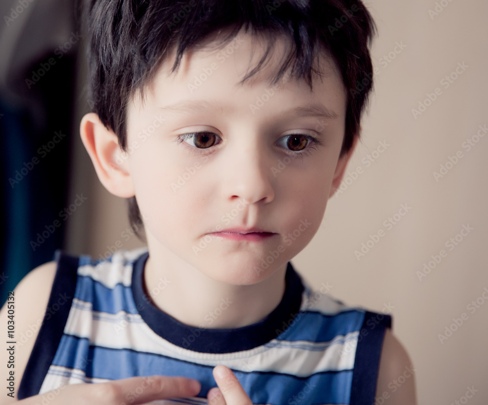 Little brunette boy wearing striped shirt indoor Little brunette boy wearing striped shirt indoor