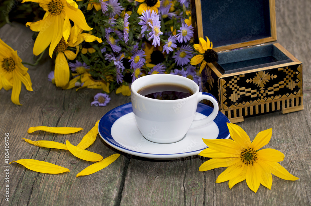bouquet of wild flowers, coffee, casket and yellow petals