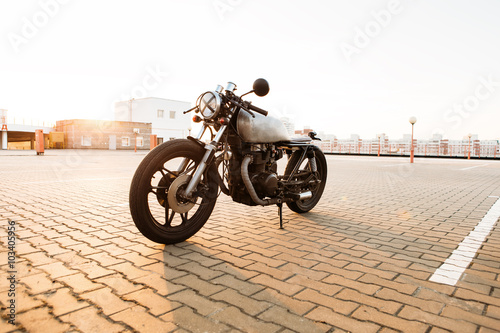 Silver vintage custom motorcycle cafe racer photo