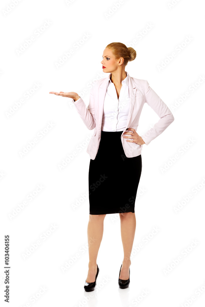 Business woman presenting something on open palm Business woman presenting something on open palm