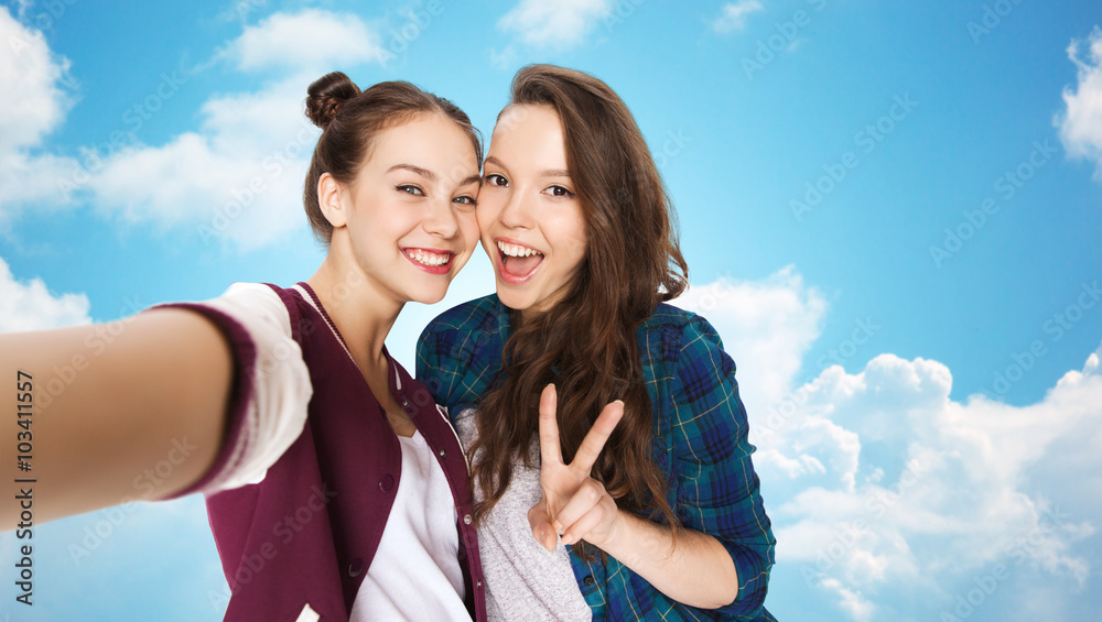 happy friends taking selfie and showing peace happy friends taking selfie and showing peace