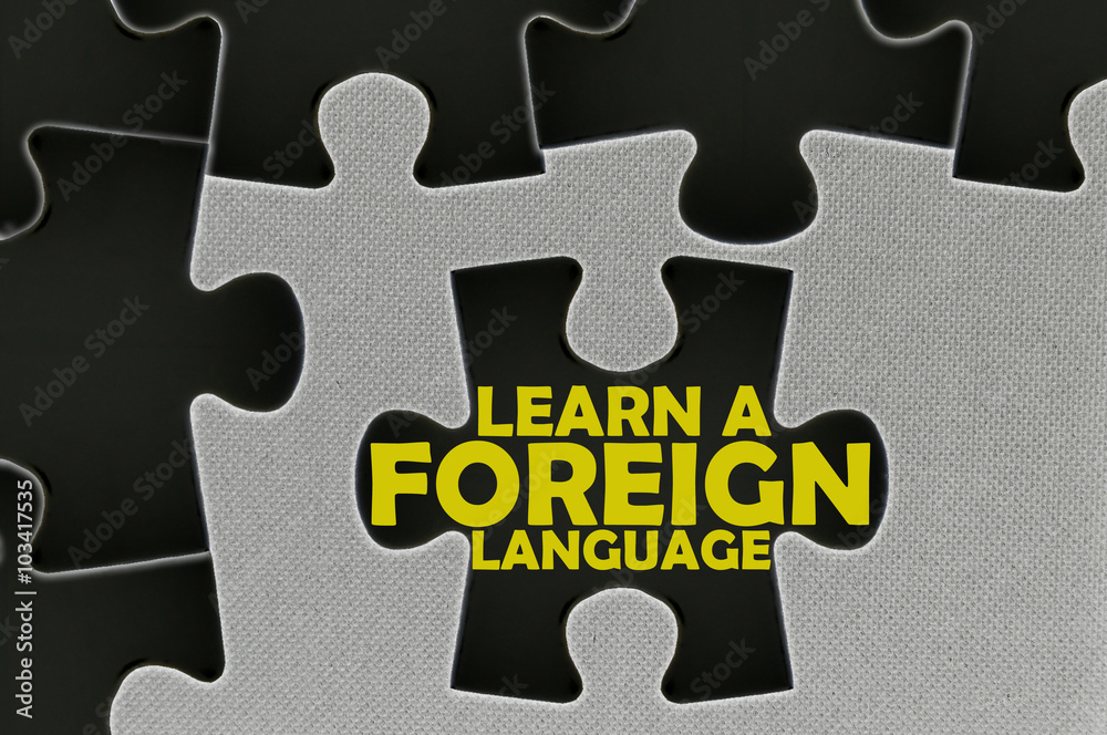 Fototapeta premium jigsaw puzzle written word learn a foreign language