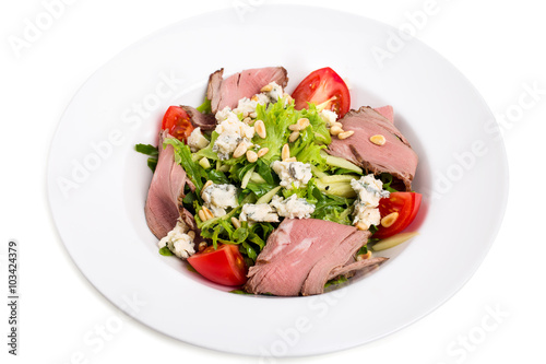 Warm roast beef salad with goat cheese.