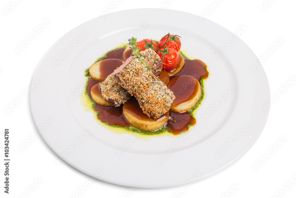 Breaded pork fillet with tomatoes confit. Breaded pork fillet with tomatoes confit.