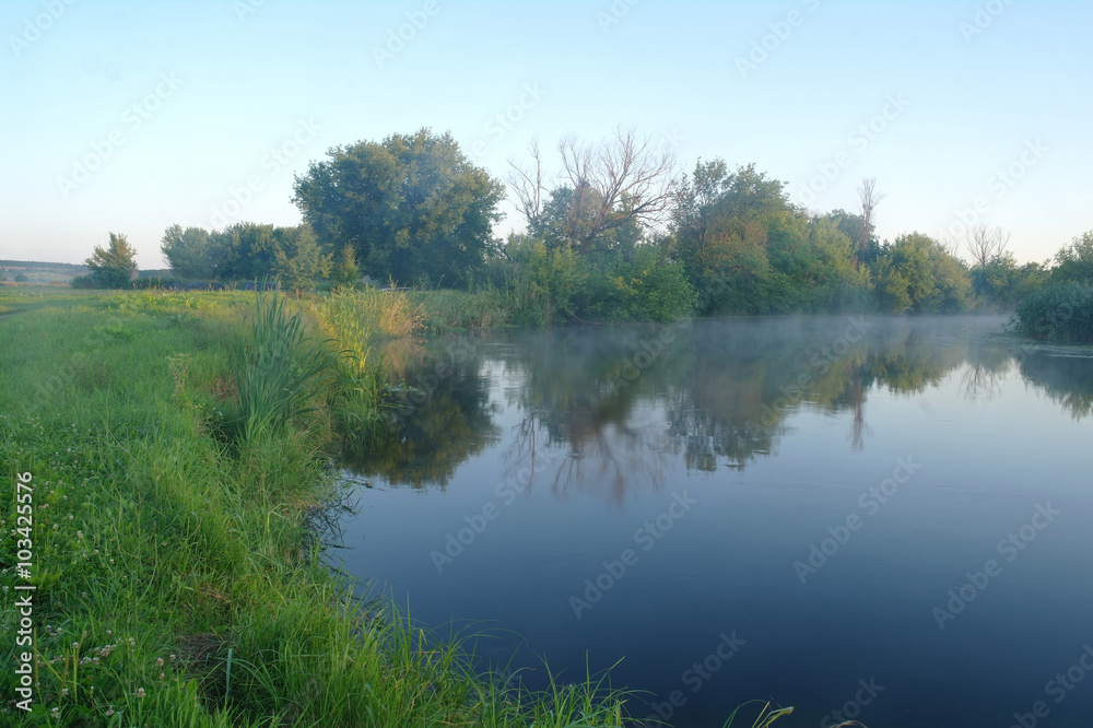 Morning landscape with fog on the river