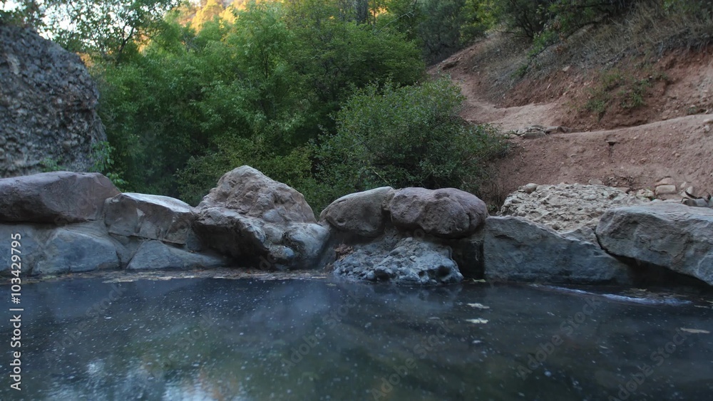 Water bubbles and steams in a hot spring in rural Utah. Water bubbles and steams in a hot spring in rural Utah.