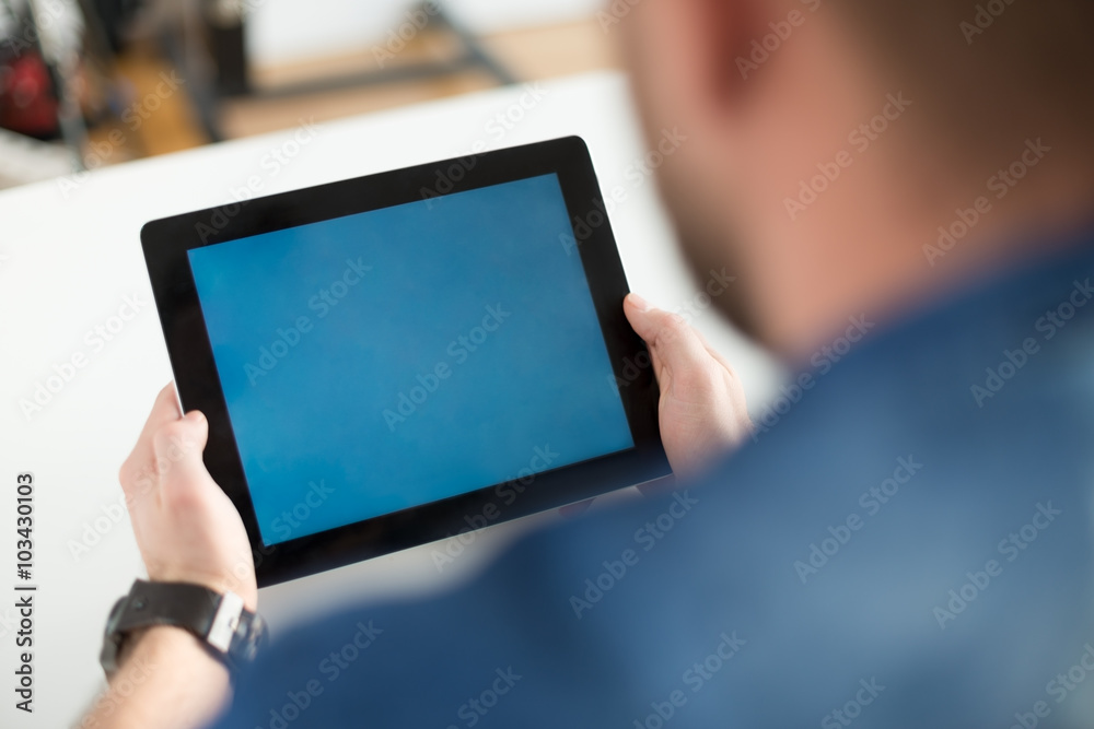 Business man holding a contemporary digital tablet