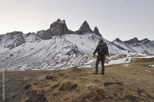 Hiker in the mountains, Aiguilles d'Arves, French Alps.