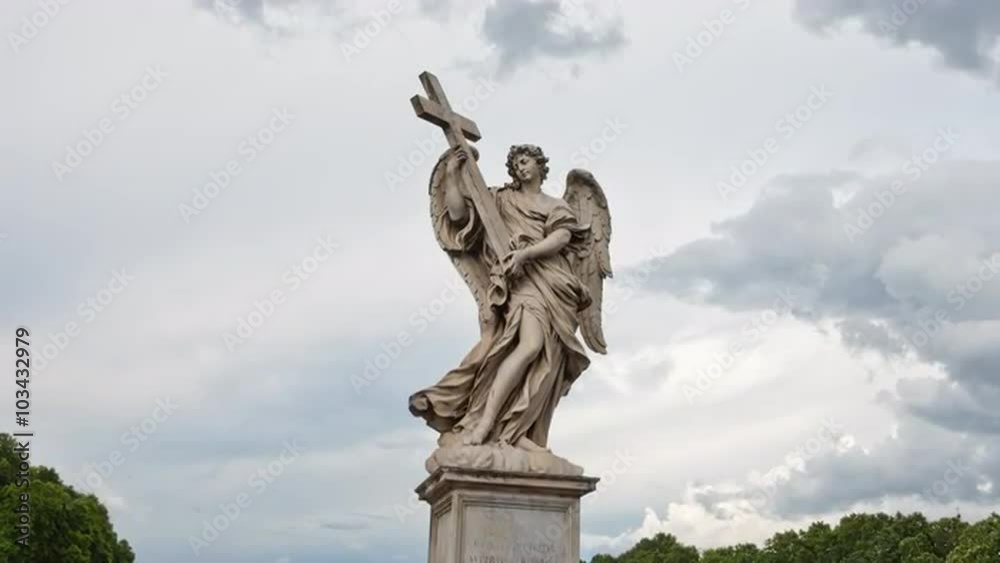 Time lapse with clouds behind the Angel with the Cross closeup on the Bridge of Hadrian (Ponte Sant’Angelo) in Rome, Italy. 4k resolution. Time lapse with clouds behind the Angel with the Cross closeup on the Bridge of Hadrian (Ponte Sant’Angelo) in Rome, Italy. 4k resolution.