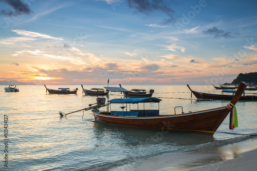 Long tail boats with sunrise sky in Koh Lipe Island