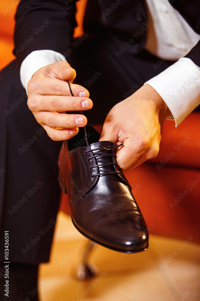 Close up image of a businessman who is preparing for his workday