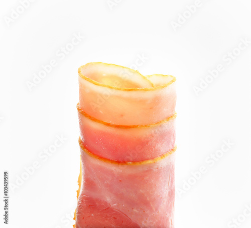 Thin slices of cooked ham, rolled up