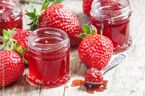 Strawberry confiture with whole berries and fresh strawberries o