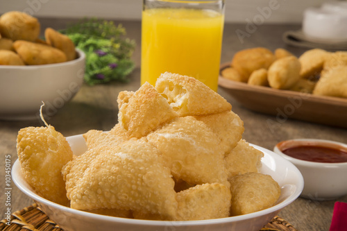 Pastel, a Brazilian snack, with a bar in the background. Cheese photo