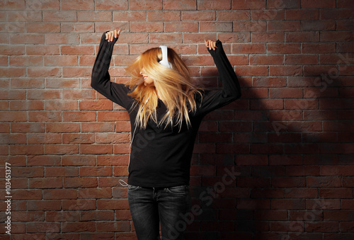 Young woman standing at the...