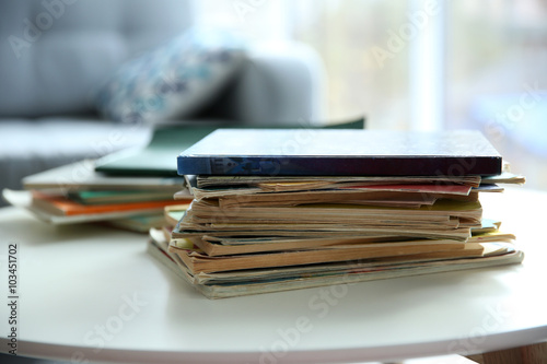 Pile of old books on white table