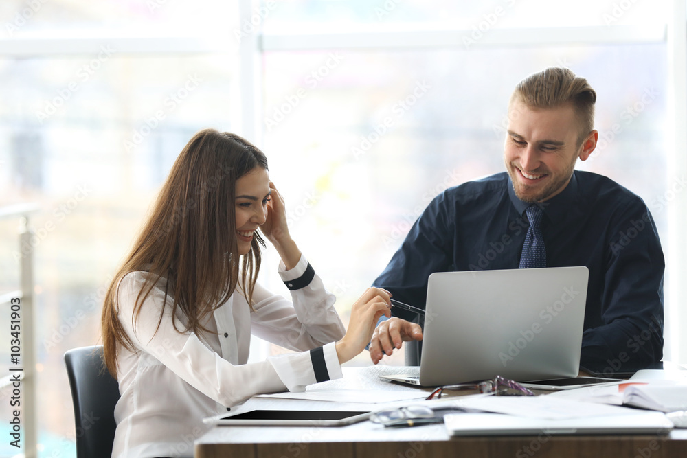 Businessman and businesswoman working in office Businessman and businesswoman working in office