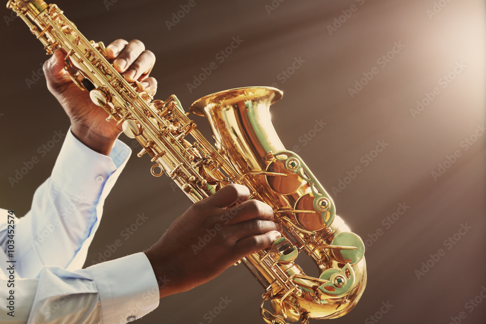 Fototapeta premium African American jazz musician playing the saxophone, closeup