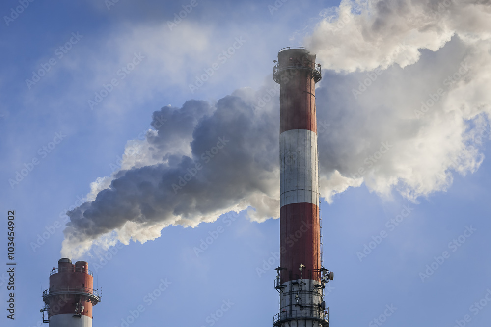 Big chimneys with dramatic clouds of smoke.