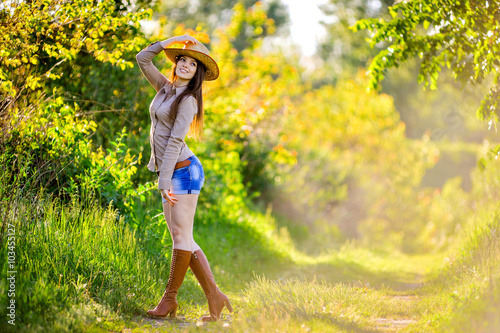 young beautiful girl in a cowboy hat © sushytska