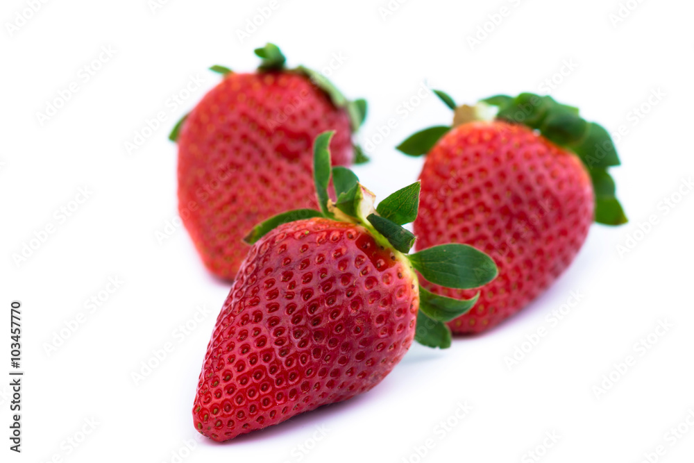 Three strawberries close up on white background Three strawberries close up on white background