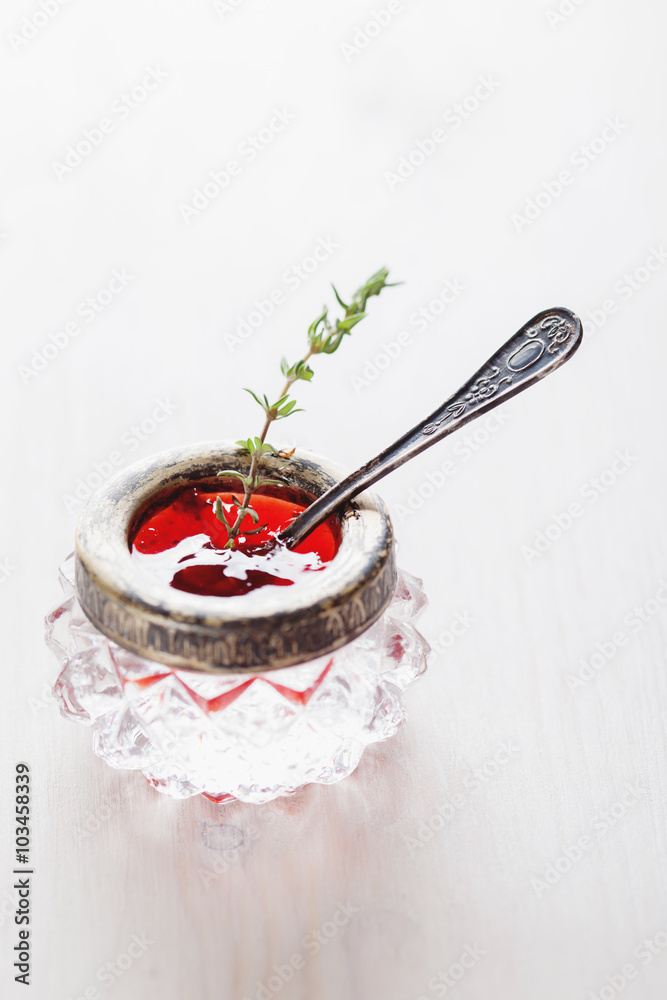 Homemade fresh tomato sauce with thyme in the silver vintage bow