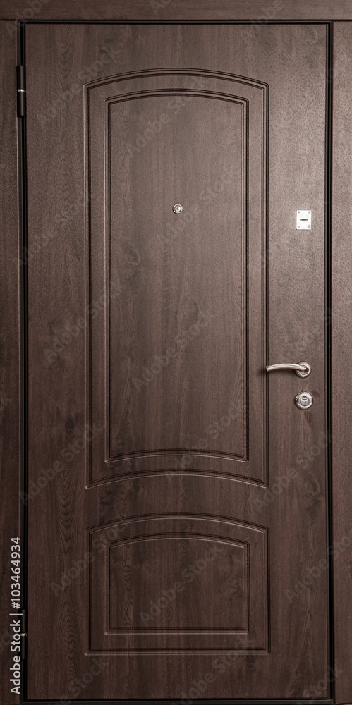 The iron door with a wooden pattern.