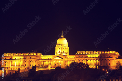 Night view of Chain bridge and royal palace in Budapest, Hungary, Vintage look