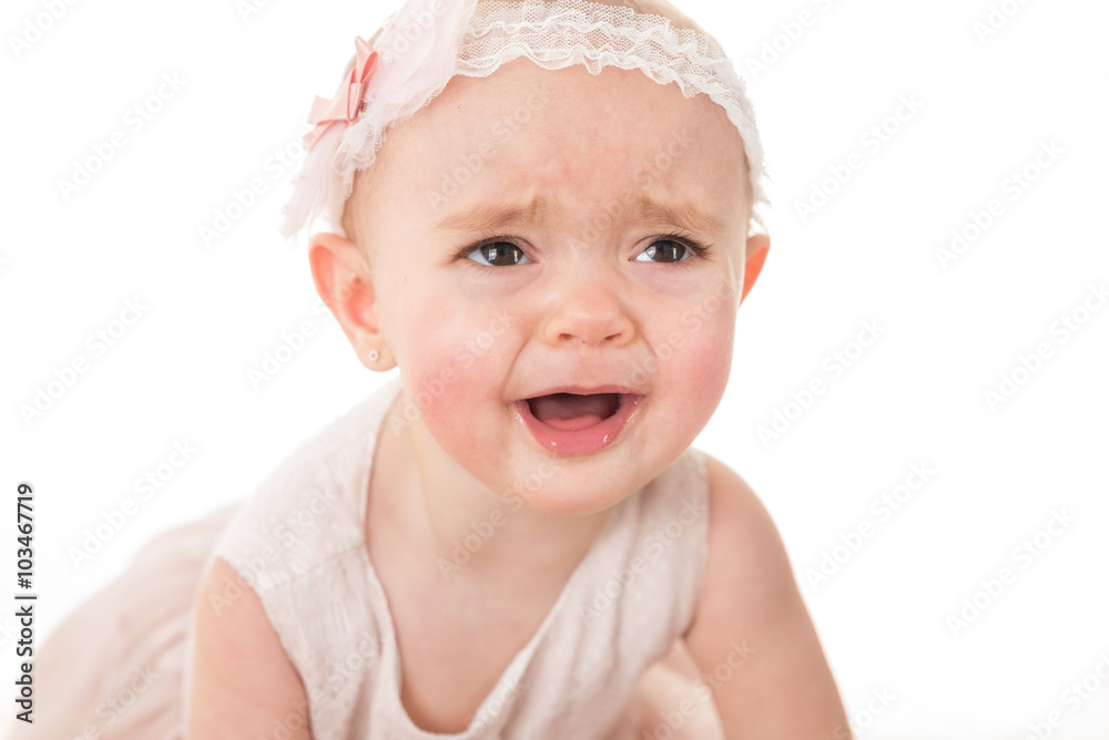 Portrait of sad little girl crying for her toy shot against white background Portrait of sad little girl crying for her toy shot against white background