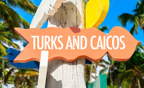 Turks and Caicos welcome sign with palm trees photo