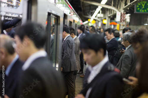 Passengers traveling by Tokyo metro.