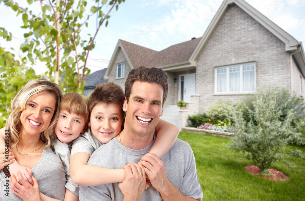 Happy family near new house. Happy family near new house.