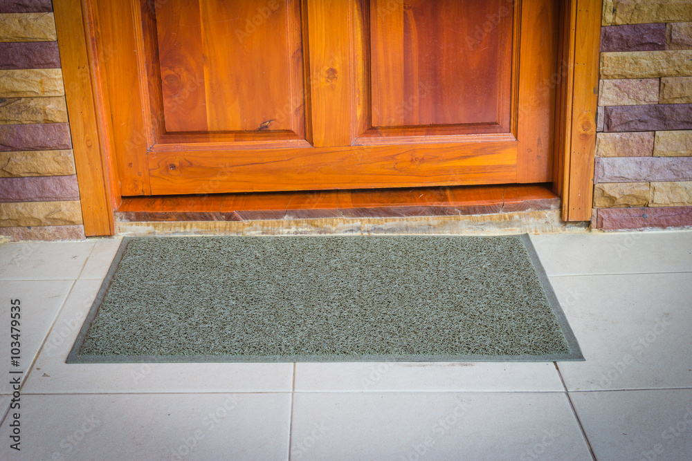 Fototapeta premium gray door mat with close door