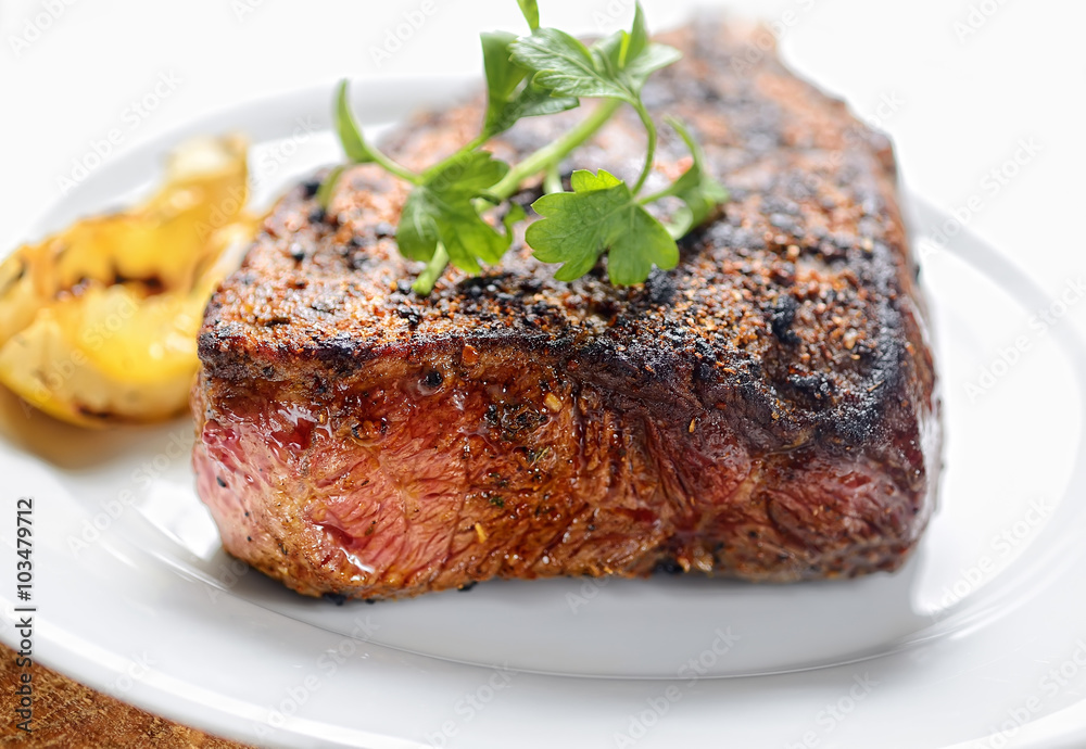 steak on a plate with greens
steak on a plate with greens