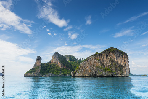 Thailand Chicken Head island cliff over ocean water during tourist boat trip in Railay Beach resort