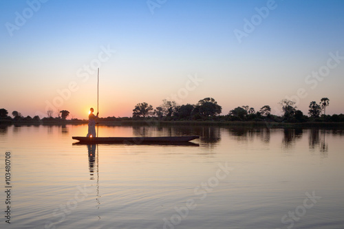 Mokoro poler in the Okavango Delta. photo